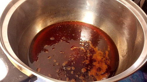 Heating of palm oil for ewa agoyin sauce