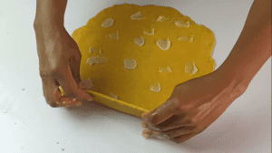 Add the shortening over the surface, fold and then roll several times.