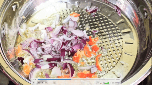 Saute the onions and scotch bonnet for about 3 minutes