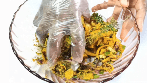 Goat meat being marinated prior to making curry goat