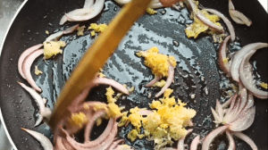 Add minced garlic and grated ginger