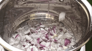 When the oil is heated, add the chopped onions