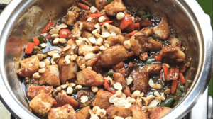 Add 1/4 cup of roasted peanuts and 1/4 cup of chopped spring onions. Mix to combine and cook for 2 minutes on medium heat.