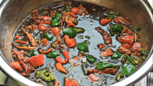Go in with the Kung Pao Sauce and simmer for 4 minutes until it is slightly thickened