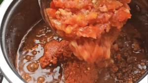 Add chopped fresh tomatoes and sugar