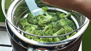 Season the broccoli with salt and cover and steam for 4 minutes