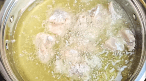 Deep fry the chicken until golden brown in color