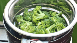 Steam the broccoli over hot boiling water