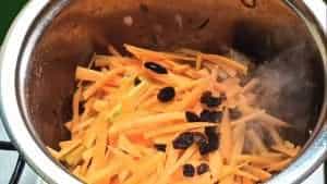 Add carrots and fruit raisins