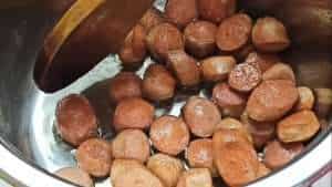 Fry the sausages until they are brown
