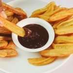 Homemade churros with chocolate dipping sauce